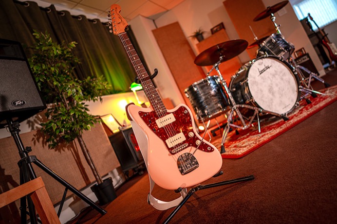 Photo of live room at Material studios with Fender Jazzmaster in front of Beverley drum kit